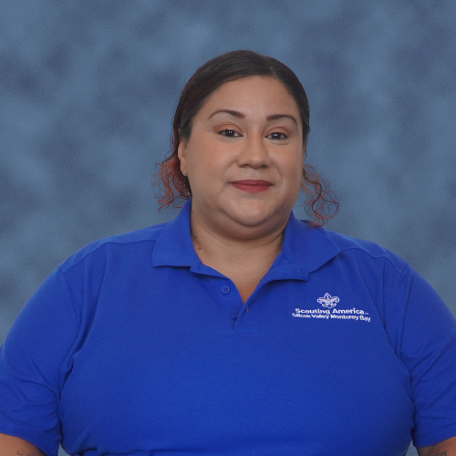 A person wearing a blue polo shirt with a "Scouting America" logo.